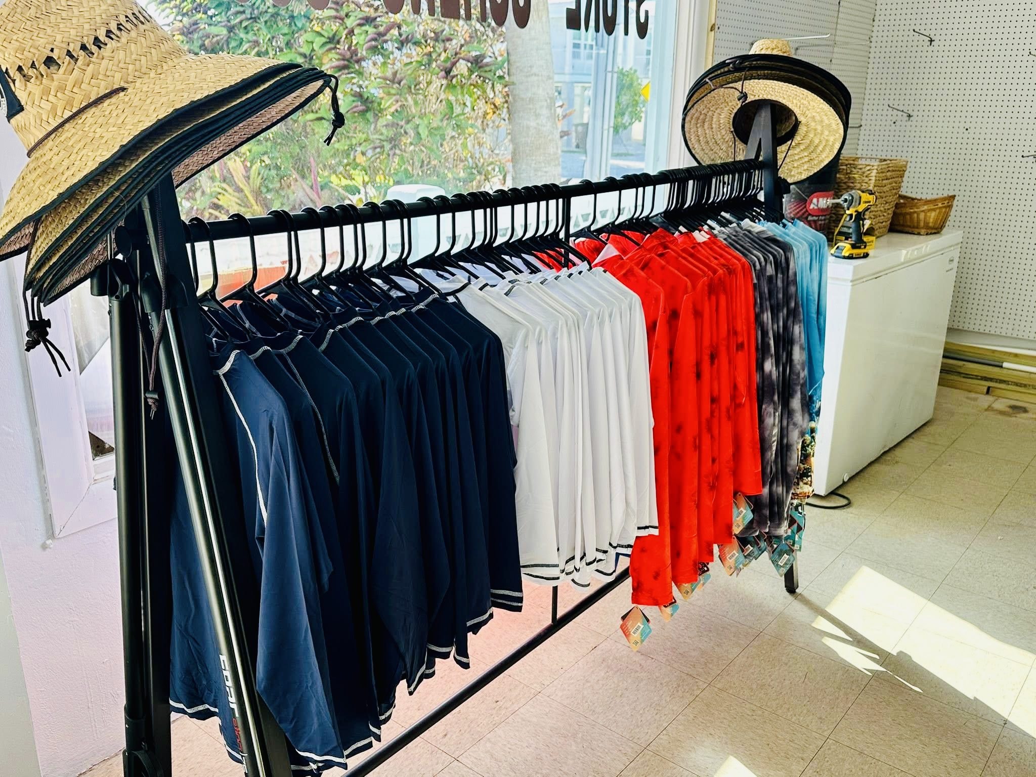 Inside Wakezone General Store — Florida Keys map mural, stocked shelves, and water cases